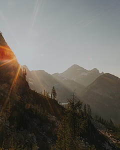 low angle photo of mountains taken at daytime thumbnail