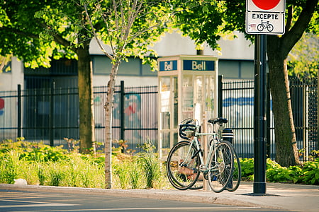 white road bike parked on side thumbnail