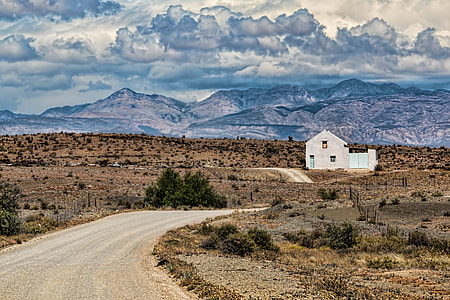 grey paint house with brown mountain top view in a distance thumbnail