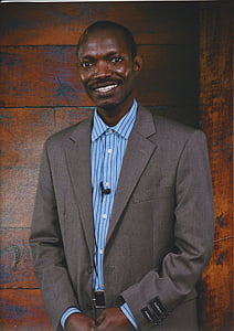 man wearing gray and blue suit smiling thumbnail