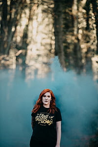 woman standing on front blue smoke bomb thumbnail