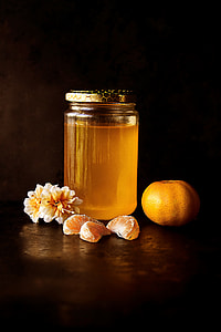 clear glass jar filled with orange fruit citrus thumbnail