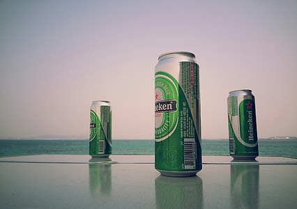 three green-and-gray Heineken beverage cans thumbnail