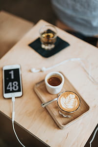clear glass teacup on brown wooden board thumbnail