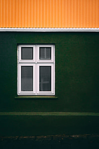 close-up photo of green concrete house with white window thumbnail