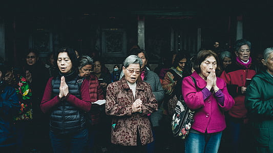 group of people praying at nighttime thumbnail