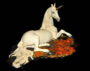 white ceramic unicorn figurine thumbnail