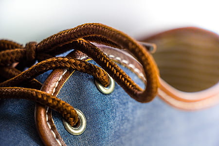 close up photography of blue low-top shoe thumbnail