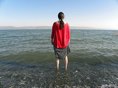 woman standing in front of sea thumbnail