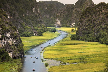 aerial view photography of river in between mountains thumbnail
