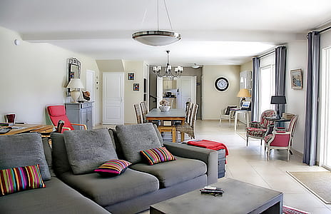 gray sectional sofa with throw pillows thumbnail
