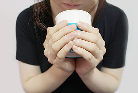 person holding white canister thumbnail