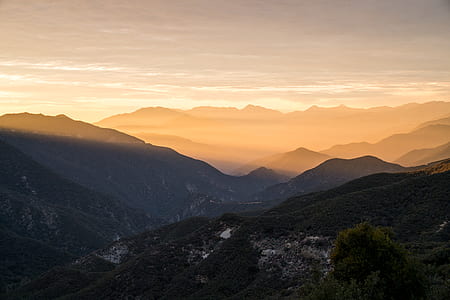 aerial photography of mountain range under golden hour thumbnail