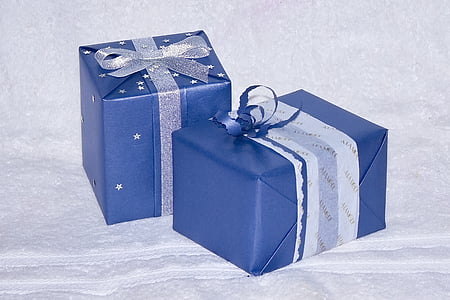 two blue gifts on white cloth thumbnail