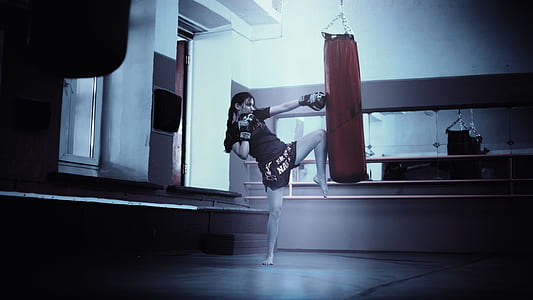woman punching red heavy bag thumbnail