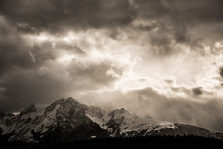 snow-covered mountain under clouds thumbnail