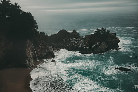 mountain beside body of water thumbnail