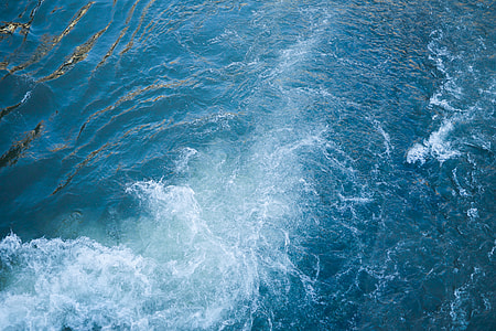 Blue Sea Waves Behind The Boat thumbnail