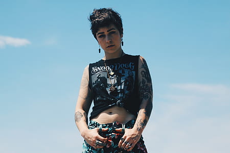 person wearing black tank top standing in open area thumbnail