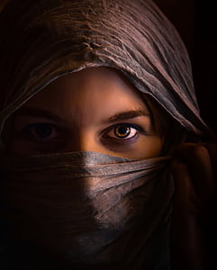 woman wearing brown hijab head dress thumbnail