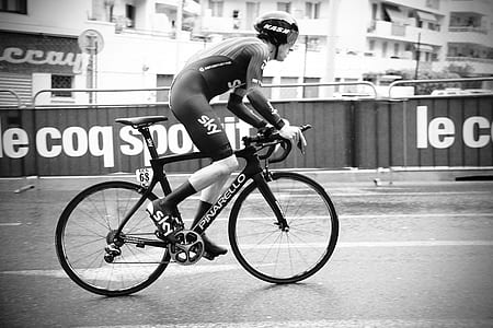 man cycling on roadbike grayscale photo thumbnail