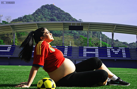 woman sitting on grass field thumbnail