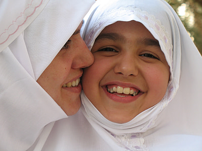 woman kissing girl on cheek thumbnail