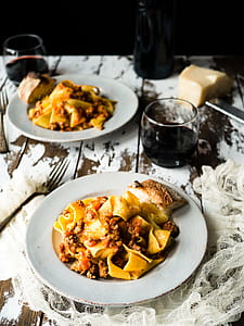 cooked pasta on white ceramic plate with fork thumbnail