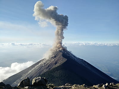 volcano with smoke during daytime thumbnail
