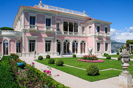 photo of pink and white painted house at daytime thumbnail