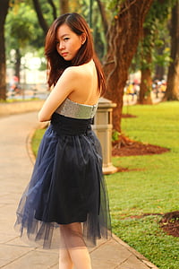 woman showing her back near trees thumbnail