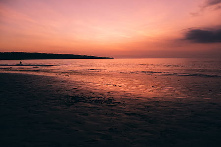 calm body of water during golden hour thumbnail