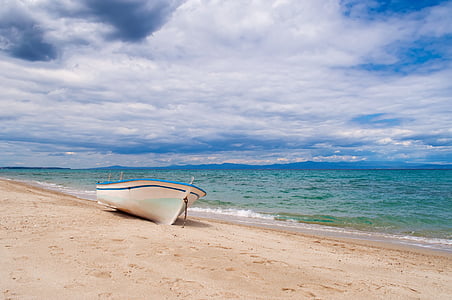 white rowboat in seashore thumbnail