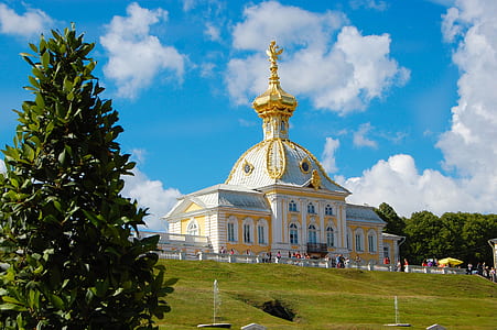 yellow and white concrete structure during daytime thumbnail