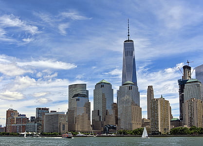 white concrete skyscrapers under cloudy sky thumbnail