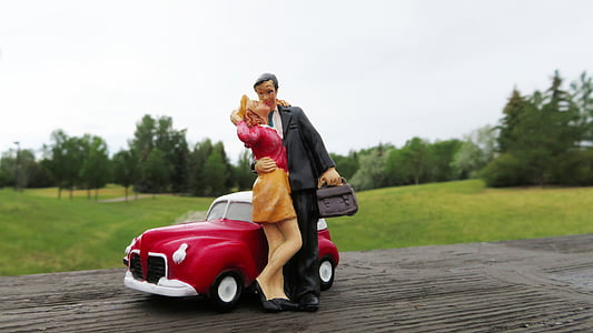 couple ceramic figurine on brown surface thumbnail