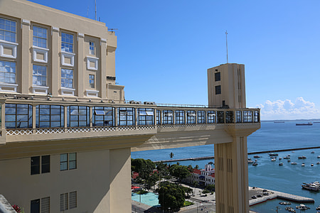 gray concrete building near ocean thumbnail