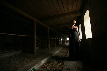 Woman Standing Near Open Window Inside Room thumbnail