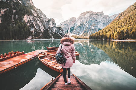 Young Woman Enjoying Beautiful Scenery of Lago di Braies, Italy thumbnail