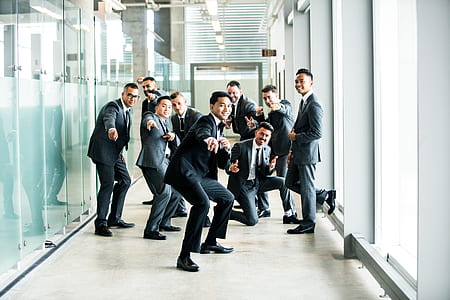 group of men's beside clear glass surface thumbnail