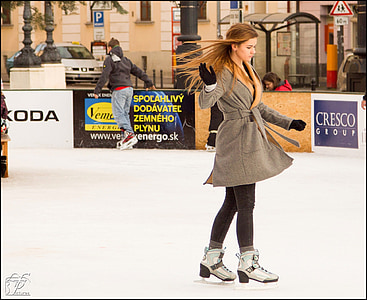 woman skating wearing brown coat thumbnail