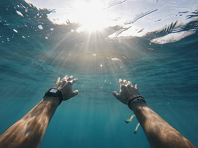 person underwater about to go surface thumbnail