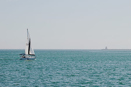 sailboat on body of water under cloudy sky thumbnail