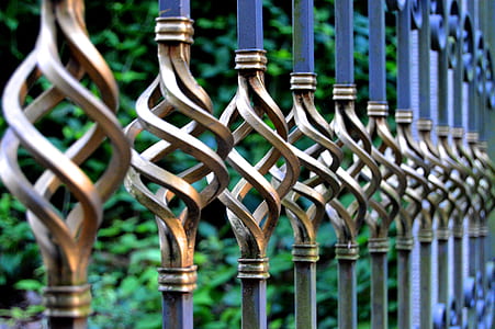 focus photo of gray and black metal gate thumbnail