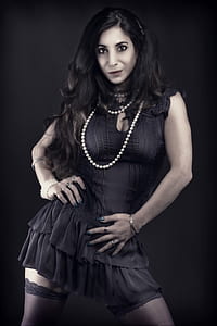 macro shot of woman wearing black dress thumbnail
