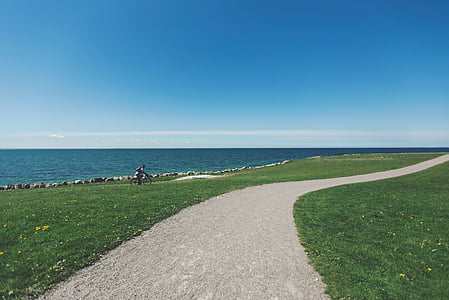 gray pathway near body of water thumbnail