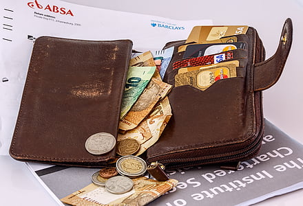 photo of brown leather wallet filled with mone y thumbnail
