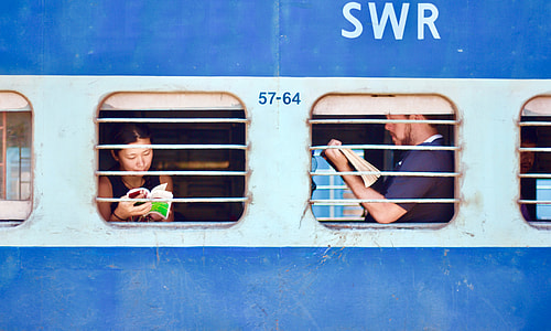 man and woman holding books inside SWR vehicle thumbnail