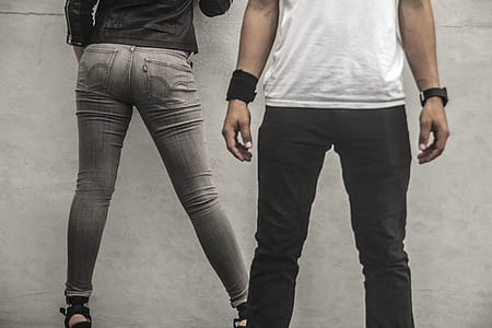 two person wearing black and gray pants standing on ground thumbnail