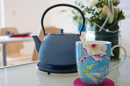 blue and white mug near blue kettle thumbnail